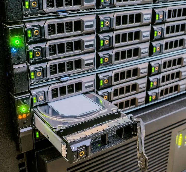Server rack with hard drive partially removed.